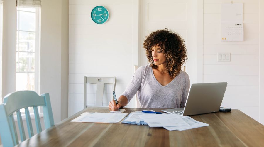 woman working on her finances at home